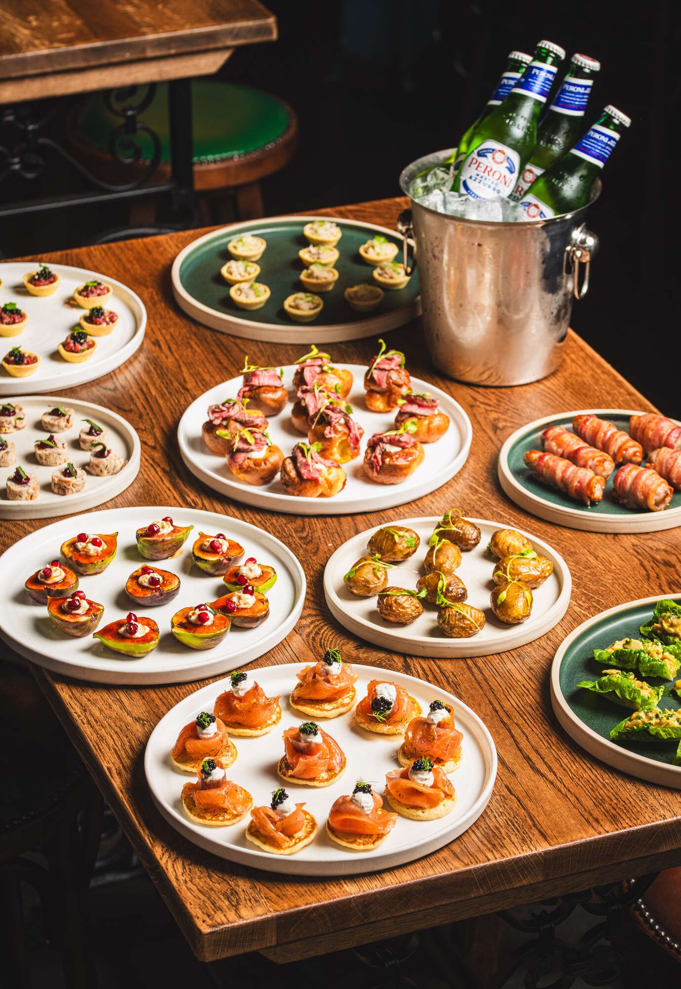 Pre-ordered sharing platters and beer bucket, ideal for group gatherings in Farringdon.