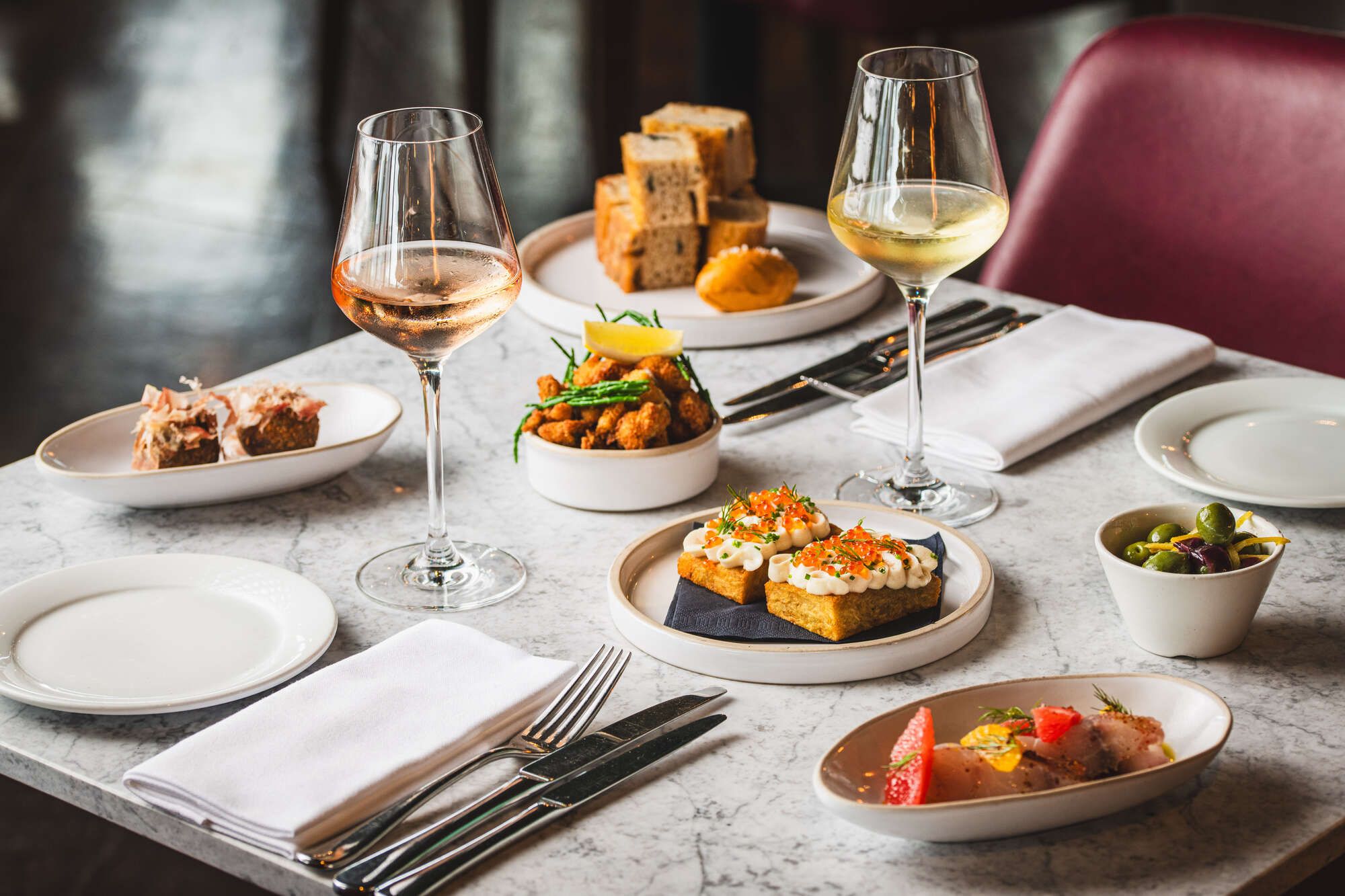 Selection of small plates and wine, perfect for an evening at Farringdon's rooftop bar.