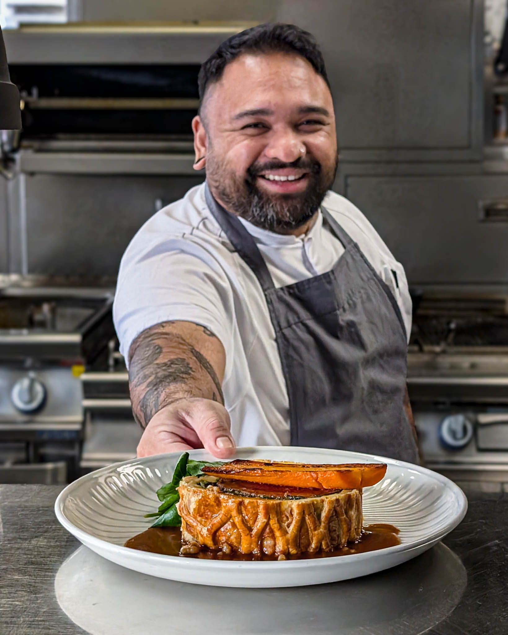Head chef of steak restaurant in Farringdon Tim Dela Cruz serves a Beef Wellington at Smiths of Smithfield in London
