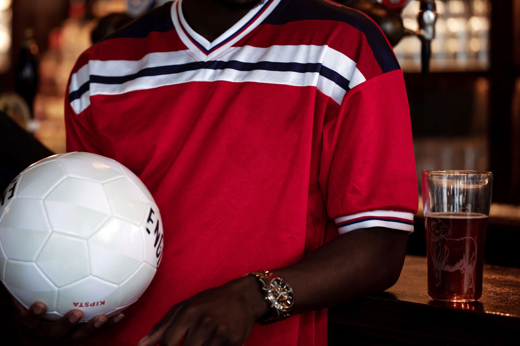 man watching a FIFA World Cup 2026 match live at a pub in Farringdon, Central London from one of the private rooms perfect for corporate events