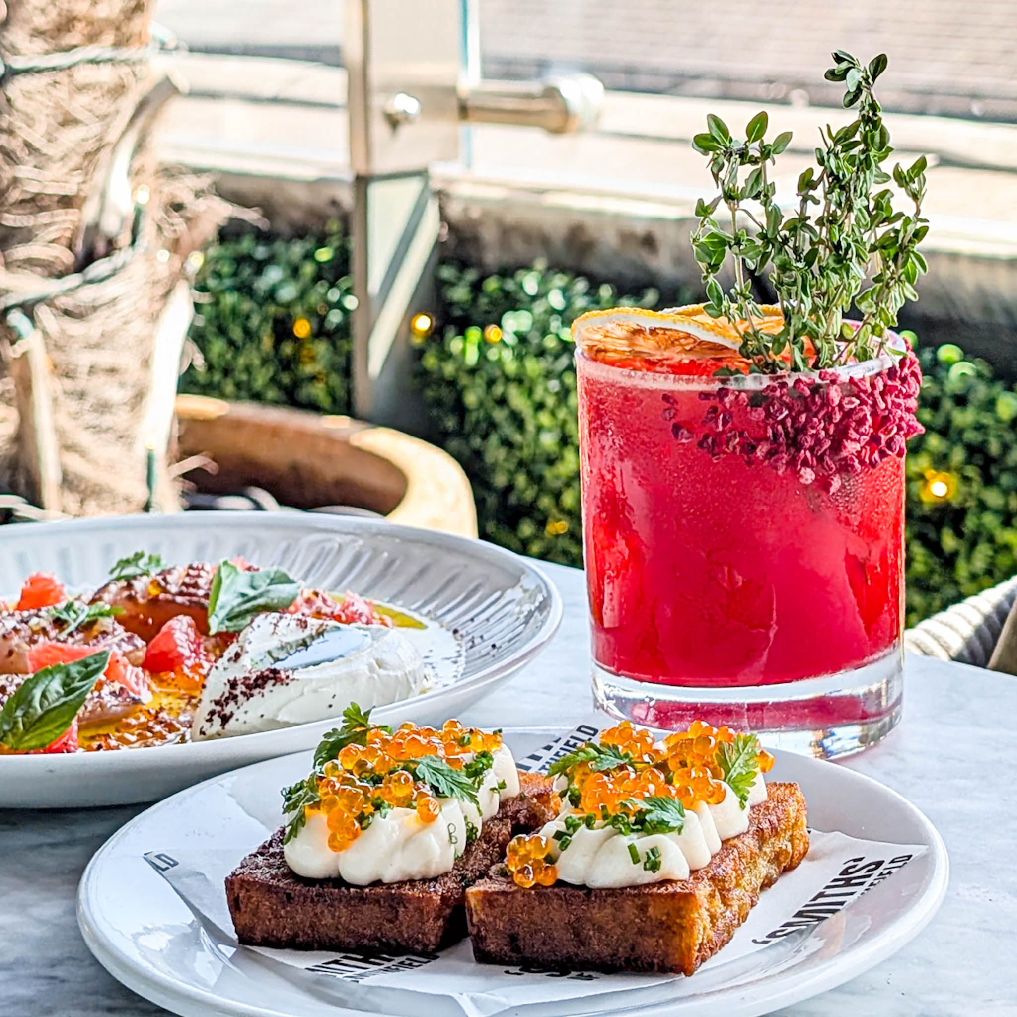 cocktails and premium bar snacks at No.3 Rooftop in farringdon on the outdoor terrace with views of London
