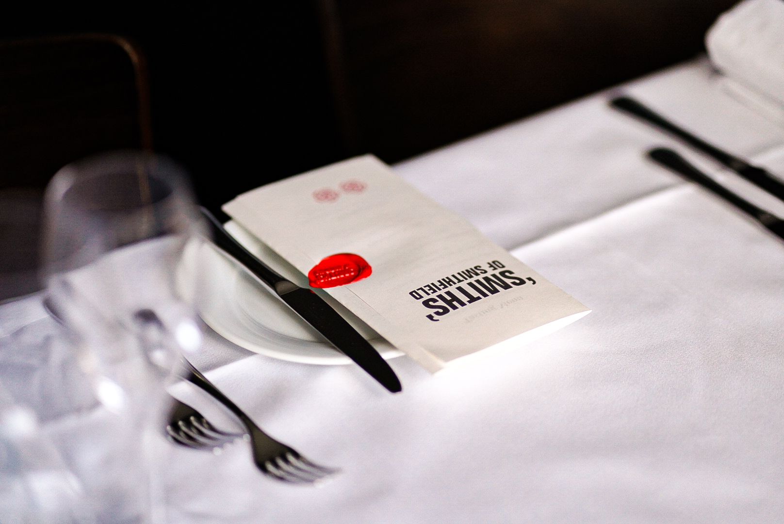 The 7-course tasting menu at The Grill, elegantly presented with a red wax seal featuring the Smiths of Smithfield logo.