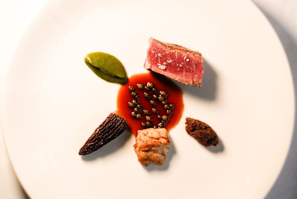 The signature Scotch beef fillet with beef XO, veal sweetbread, and morels, sourced from Smithfield Market for the 7-course tasting menu.
