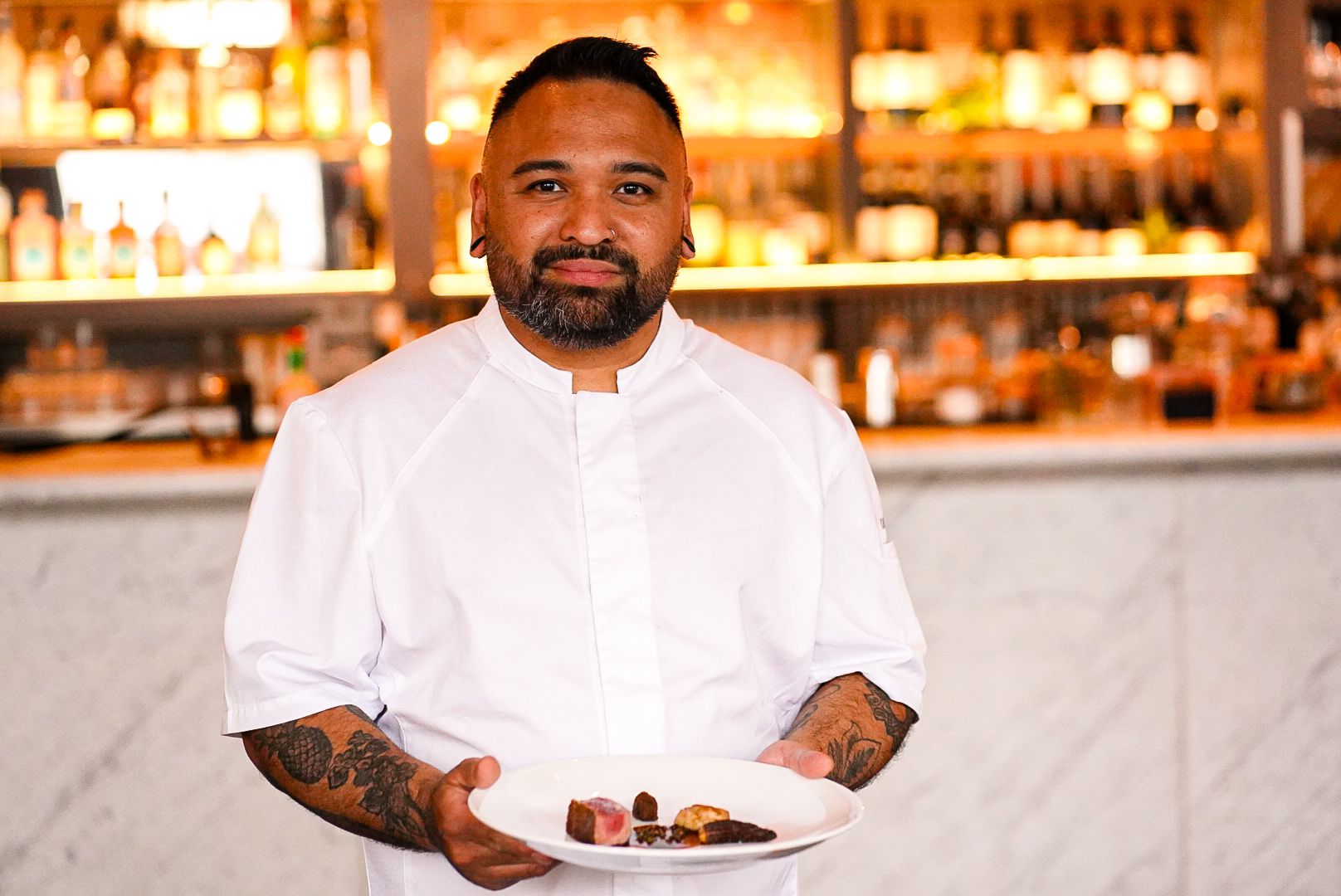 Head Chef Tim Dela Cruz proudly presents his signature Scotch beef fillet, a highlight of the 7-course tasting menu at The Grill.