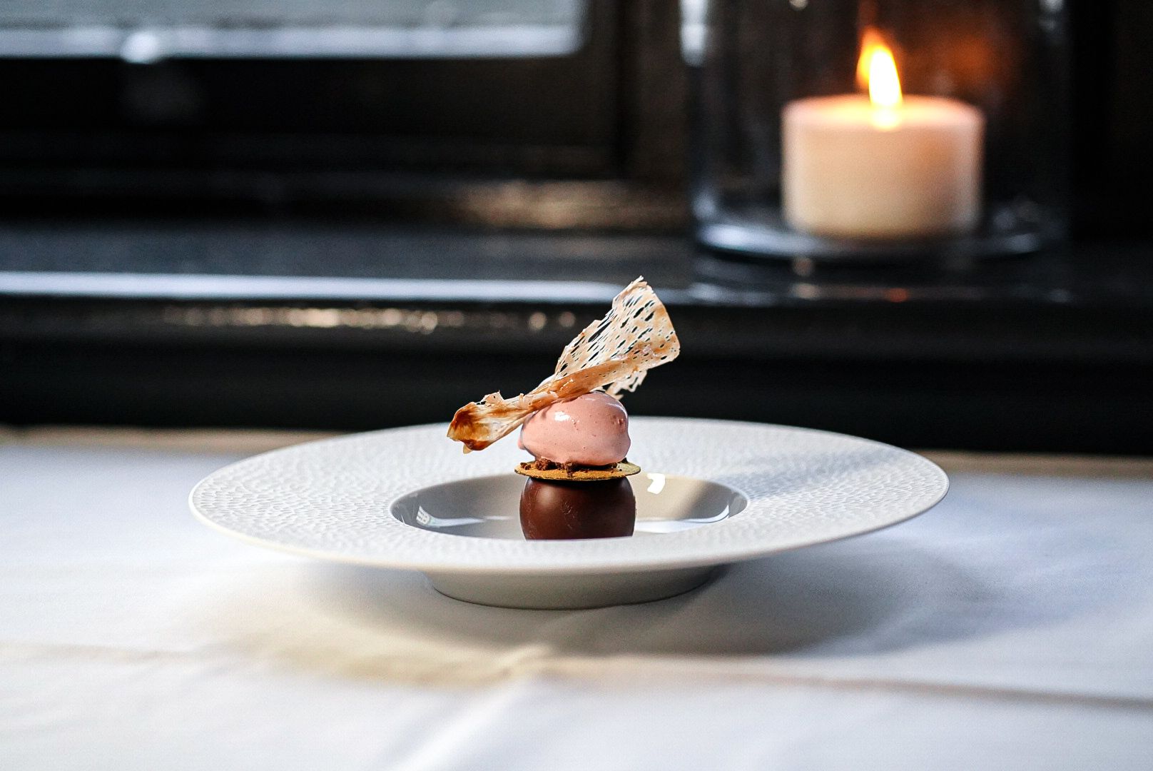 A decadent Mayan chocolate dessert with sour cherry and cherry ice cream, served as the final sweet course of the 7-course tasting menu.